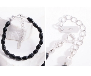 Detailed view of S925 sterling silver clasp and black agate beads on a beaded bracelet