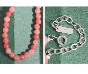 Close-up of S925 sterling silver clasp and pink agate beads on a beaded necklace