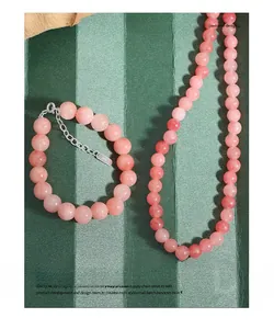 Detailed macro view of natural pink agate beaded bracelet with S925 silver clasp