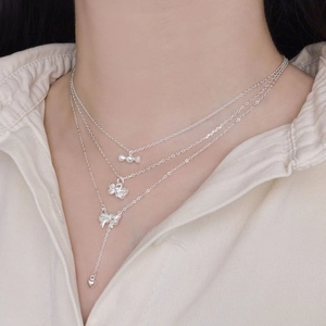 Three-layer 925 sterling silver necklace with heart, bow and candy shaped pendants