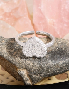 Macro shot of S925 sterling silver heart ring with lava texture and adjustable band