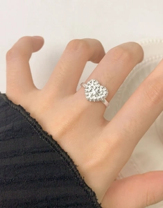 Close-up of S925 sterling silver heart ring with pavé-set shimmering zircon stones