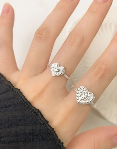 Close-up of S925 sterling silver heart rings with lava texture and leaf patterns