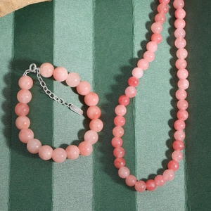Pink natural agate beaded necklace and bracelet set with S925 silver on green fabric