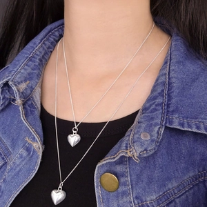 Dual-layered S925 sterling silver heart pendant necklace on casual model styling