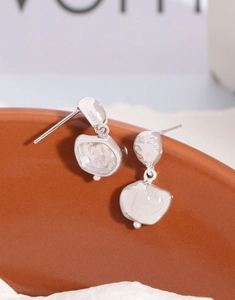 Detail of irregular S925 sterling silver stud earrings with liquid metal finish