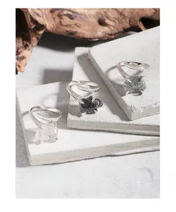 Macro detail of S925 silver snake ring with natural black rutilated quartz stones