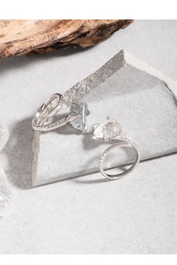 Detailed macro view of S925 sterling silver snake rings with natural black rutilated quartz