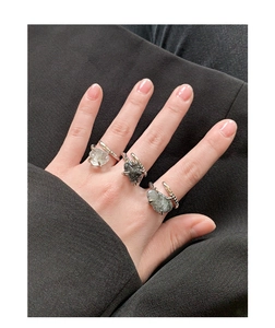 Close-up of S925 silver rings with natural black rutilated quartz and spiral texture