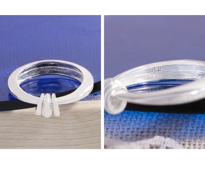 Macro shot of S925 sterling silver ring showing hallmark and triple parallel ridges