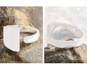 Macro detail of S925 sterling silver stamp and polished irregular geometric ring band