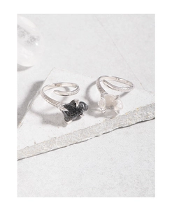 Macro shot of S925 sterling silver snake texture ring with natural black crystal stone