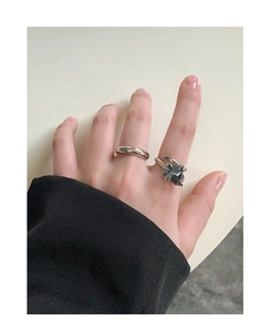 Detail of S925 sterling silver snake ring set with natural black rutilated quartz stone