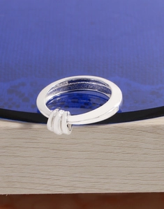 Detailed close-up of S925 sterling silver stamp on the inner band of irregular triple rings