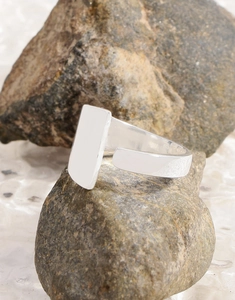 Macro shot of S925 sterling silver geometric ring on raw stones with industrial design