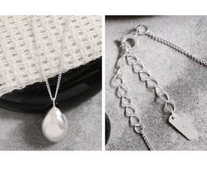 Detail of S925 sterling silver drop pendant and clasp with metal hallmark tag