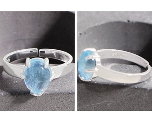 Detail view of pear-cut blue aquamarine S925 sterling silver ring with hallmark