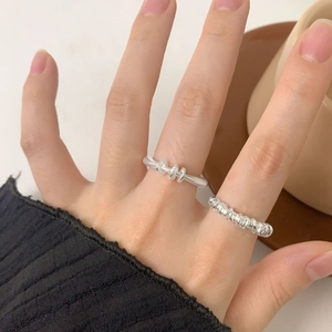 S925 sterling silver triple-ring minimalist band worn with a textured stackable ring