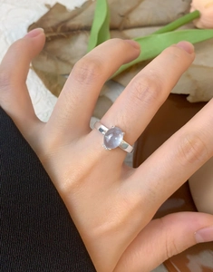 Detail of s925 silver ring with oval lavender gemstone in four-prong setting