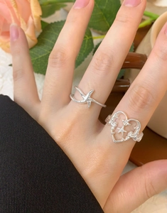 Detail of S925 sterling silver open rings with minimalist star and hollow heart designs