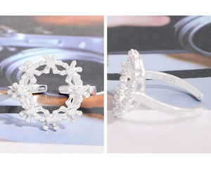 Detailed close-up showing S925 hallmark on the inner band of adjustable floral silver ring