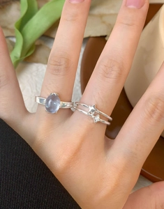 S925 silver rings with oval gemstone and star design worn on hand for layered style