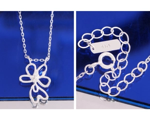 Detail showing S925 silver stamp on a minimalist hollow flower pendant necklace chain