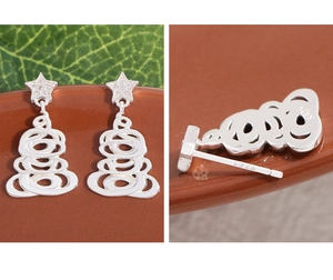 Close-up of S925 sterling silver Christmas tree earrings with star zircon studs