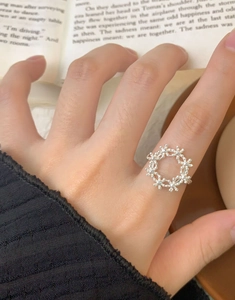 Close-up of a S925 sterling silver floral wreath ring with delicate bead details