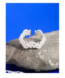 Detailed view of S925 sterling silver twisted woven ring on natural grey stone