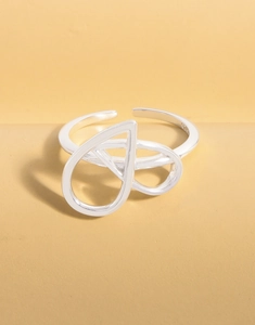 Close-up of S925 sterling silver hallmark on the inner band of irregular heart ring