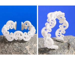 Macro view of S925 sterling silver braided ring showing twisted texture and S925 hallmark