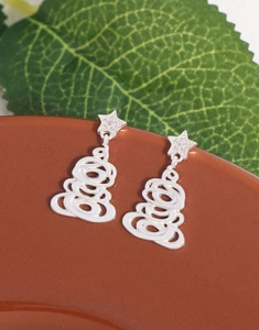 Detailed close-up of S925 silver Christmas tree earrings with star-shaped zircon studs