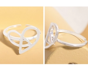 Close-up of S925 sterling silver heart ring with adjustable band and inside engraving