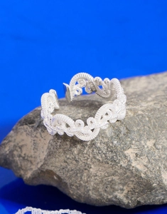 Macro shot of S925 sterling silver stamp on the inner band of a twisted woven ring