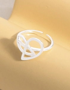 Macro shot of S925 sterling silver ring showing abstract heart geometric design