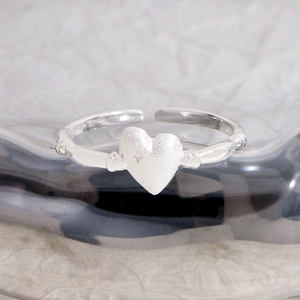 Matte silver heart ring in S925 sterling silver with adjustable band and star detail