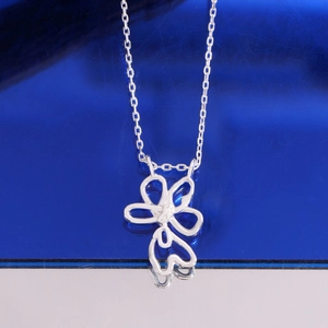 Minimalist S925 sterling silver necklace with hollow flower heart pendant on blue background