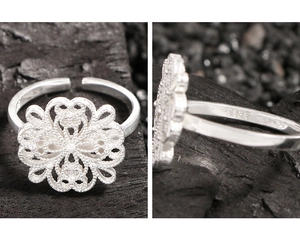 Macro detail of S925 hallmark on hollowed flower silver ring with intricate patterns