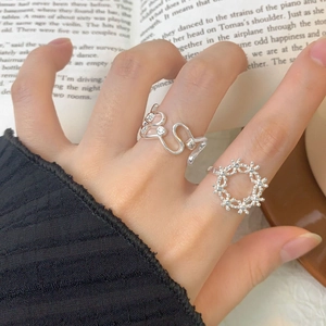 Minimalist S925 sterling silver ring set featuring wave design and open flower ring