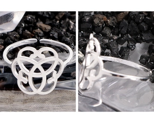 Close-up of S925 sterling silver ring showing hollow heart design and material hallmark