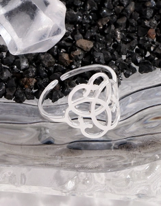 Macro shot of S925 sterling silver open ring with intricate hollow Celtic knot design