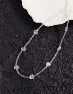 Detailed view of iridescent heart crystal beads on an elegant S925 silver necklace