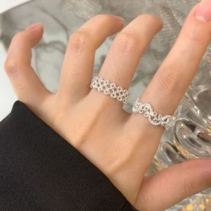 S925 sterling silver woven lace and lava texture rings shown on a hand