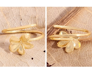 Detailed macro view of S925 hallmark on a gold floral sterling silver ring