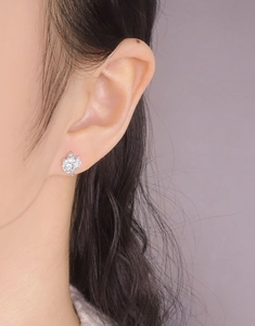 Macro view of S925 sterling silver stud earring with sparkling marquise zircon crystals