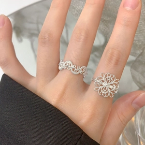 S925 sterling silver hollow flower rings with vintage woven design worn by model