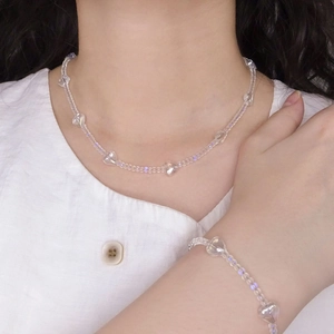 S925 silver beaded heart necklace and bracelet set shown on model with white shirt