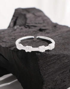 Close-up of S925 sterling silver stamp and spiral texture on minimalist ring
