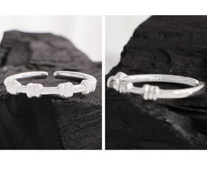 Detailed view of S925 sterling silver spiral ring with textured finish and inner hallmark